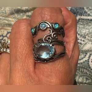 Sterling silver 925 stamped blue topaz with opal inlay accents.